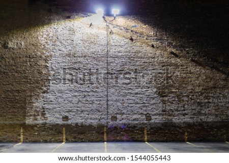 A brick wall with overhead light in Chicago's southside