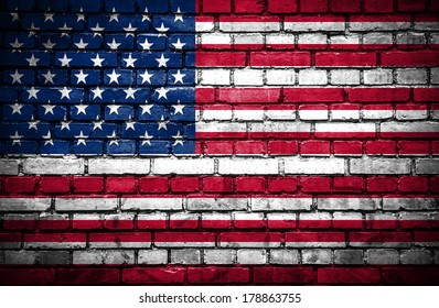 Brick wall with painted flag of United States of America
