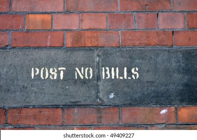 Brick Wall With Post No Bills Sign