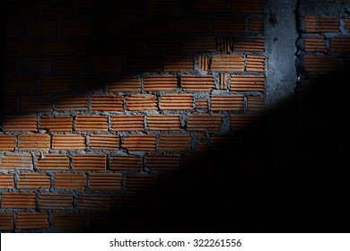 Brick Wall In Residential Construction Site With Light Sunshine Through The Window