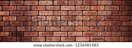 Brick wall texture or background. Brick line are perpendicular to shot dimension.  Light brown colored bricks.
