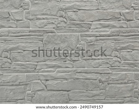 Brick wall texture, closeup of an old exterior surface as a background. Building face wall, convex joint line between dissimilar faded bricks brings character and dimensionality to vintage masonry.
