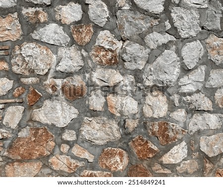 Brick wall texture, closeup of an old exterior surface as a background. Building face wall, convex joint line between dissimilar faded bricks brings character and dimensionality to vintage masonry.
