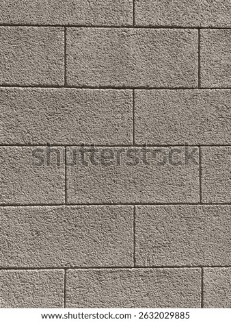 Brick wall texture, closeup of an old exterior surface as a background. Building face wall, convex joint line between dissimilar faded bricks brings character and dimensionality to vintage masonry.