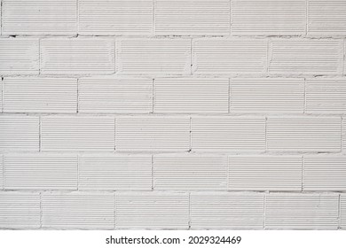 Brick wall texture with cracked tiles and cement. Classic brickwall surface background