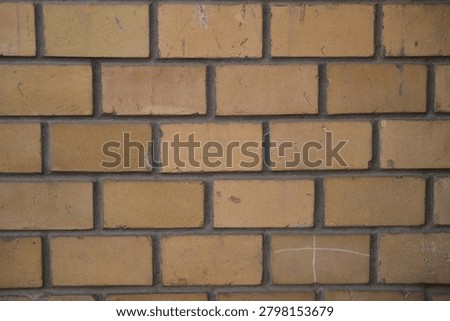 Brick wall texture with mortar lines, masonry pattern, warm brown tones, urban architecture background