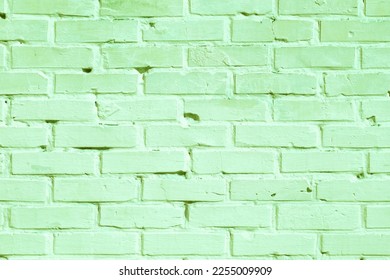 Brick wall with unusual green bricks made of whole green bricks and broken green bricks for an abstract green background - Shutterstock ID 2255009909