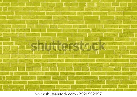 Brick wall with unusual yellow bricks made of whole yellow bricks and broken yellow bricks for an abstract yellow background