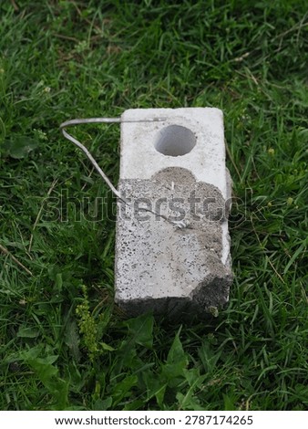 brick with wire for cladding a building. flexible bond brick