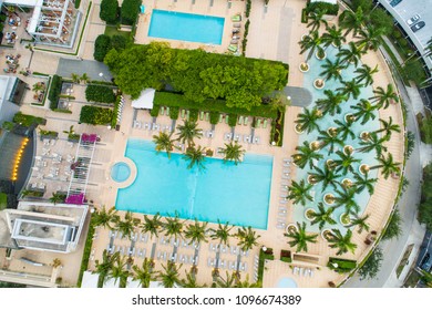 BRICKELL MIAMI, FL, USA - MAY 20, 2018: Aerial pool deck with palm trees and lounge chairs Four Seasons Hotel Brickell