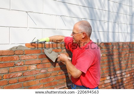 Bricklayer is building
