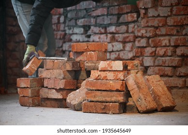 Bricklayer Is Laying A Brick Close Up.