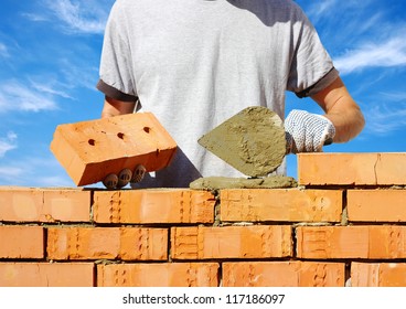 Bricklayer Laying Bricks To Make A Wall