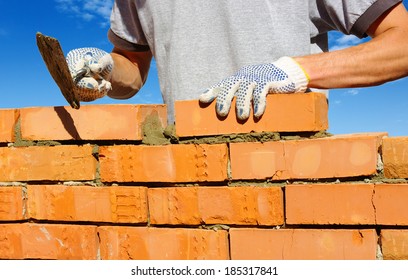 Bricklayer Laying Bricks To Make A Wall 