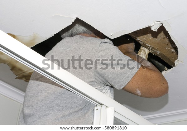 Bricklayer Mason Worker Repair Plaster Ceiling Stock Photo