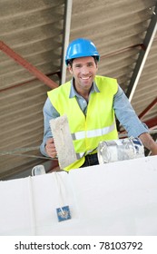 Bricklayer at work on construction site