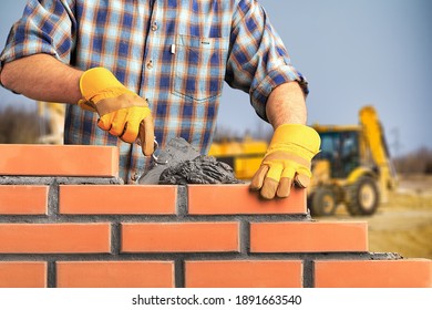 Bricklayer Worker Installing Brick Masonry