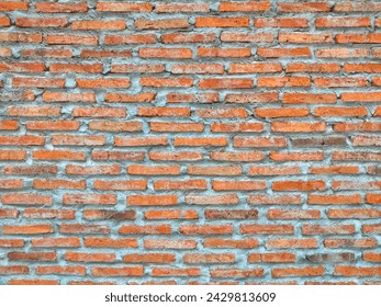 The bricks are arranged in a pattern, resulting in a sturdy wall. Background and texture themes