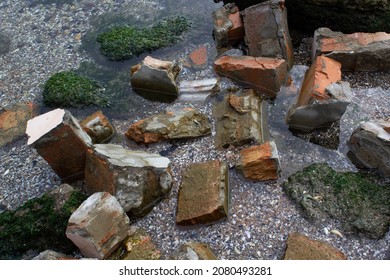 Bricks Of Broken House Wall Into Water 