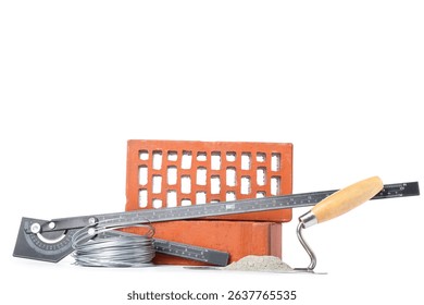 Bricks and construction tools with cement on white background