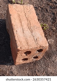 Bricks are rectangular building blocks made from clay, shale, or other materials, fired in a kiln to create a hard, durable structure, commonly used in construction for building walls and other struct