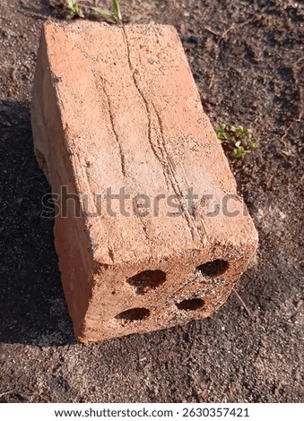 Bricks are rectangular building blocks made from clay, shale, or other materials, fired in a kiln to create a hard, durable structure, commonly used in construction for building walls and other struct