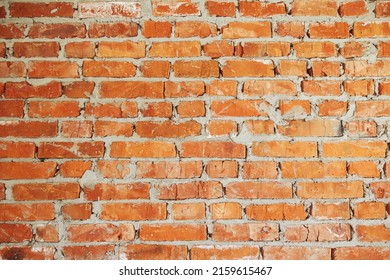 Bricks Wall Masonry Close Up With Cement. Process Of House Building And Building Materials Concept. Red Bricks Laying At Construction Site. Brick Wallpaper Pattern