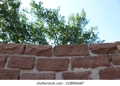 Brickwork with a background of trees