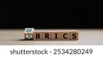 BRICS economic business international cooperation concept. Wooden cube block print screen person.