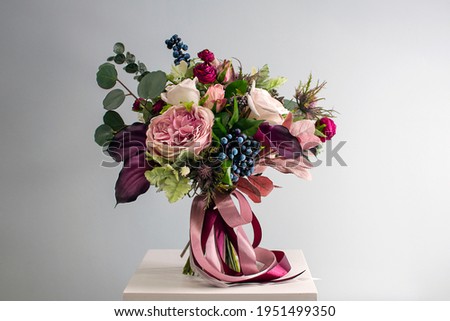 Bridal arrangement. Wedding flowers close-up. Decoration of roses, flowers and ornamental plants, close-up, selective focus, nobody, objects. luxury artificial bouquet of colorful flowers for banner.