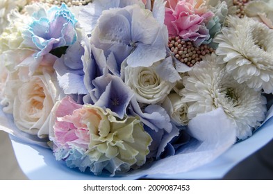 Bridal Bouquet With Blue Hydrangeas, White Roses And Rainbow Carnations