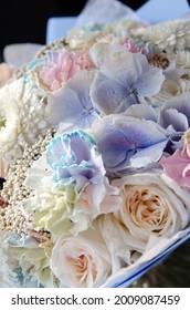 Bridal Bouquet With Blue Hydrangeas, White Roses And Rainbow Carnations