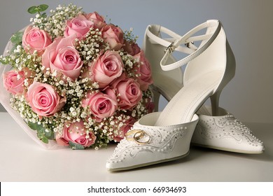 bridal bouquet posy with wedding shoes and rings