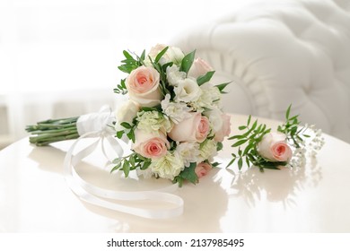Bridal bouquet of roses for the wedding. Groom's boutonniere. Wedding accessories from natural flowers. Wedding day
