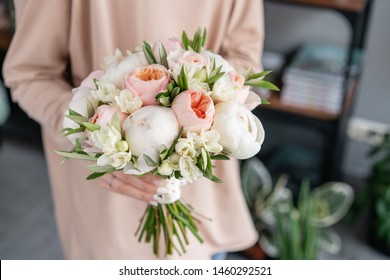 Bridal bouquet with white. Beautiful bouquet of mixed flowers in woman hand. Floral shop concept . Handsome fresh bouquet. Flowers delivery