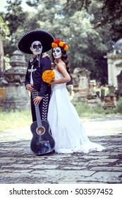 Bridal Couple With Makeup And Costumes Typical Mexican In A Cementery.