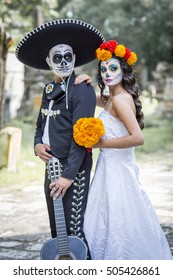 Bridal Couple With Makeup And Costumes Typical Mexican In A Cementery.