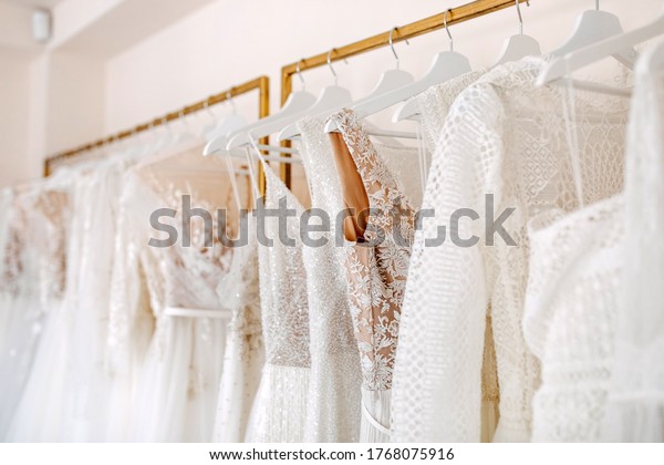 Bridal dresses collection at showroom. Luxury\
bridal gowns shop.