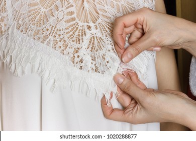 Bridal Gown Fitting. Seamstress Prepares Dress To The Fitting.