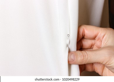 Bridal Gown Fitting. Seamstress Prepares Dress To The Fitting.