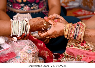 Bridal hand with wearing gold bangle at wedding time. A ritual of hindu wedding. - Powered by Shutterstock