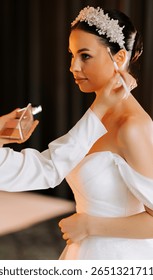 Bridal makeup application in an elegant setting just before the wedding ceremony