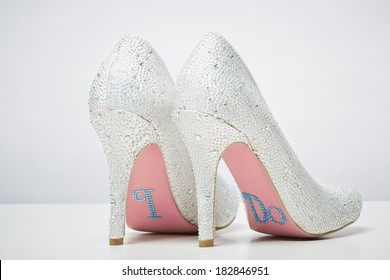 Bridal Wedding Shoes With I Do Message On Sole Isolated On White Background. Marriage Concept