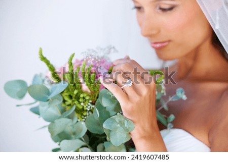 Bridal, wedding and woman with flowers, veil and engagement ring for marriage ceremony. Jewelry, beauty and young bride with makeup face and floral bouquet for elegant, romantic and love reception.