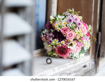 Bridalbouquet on the Window sill of a old wooden farmer house