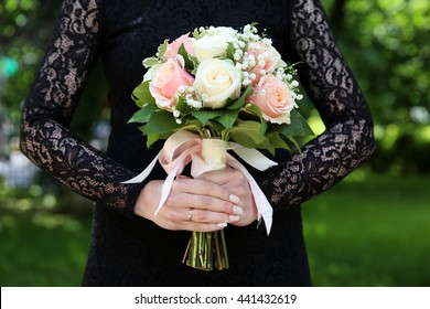 Bride In Black Wedding Dress With Wedding Bouquet In Her Hands