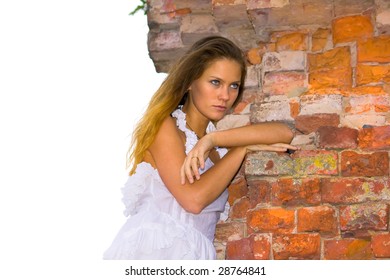 The bride at a brick wall