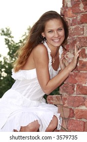 The bride at a brick wall