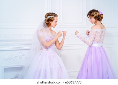 The Bride And Bridesmaid Are Going To Fight. Wedding Concept. 