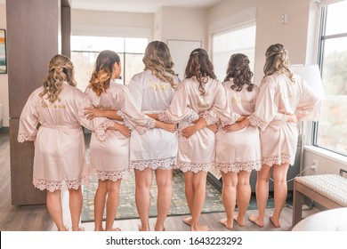 Bride and bridesmaids in champaign robes
